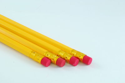 Close-up of colored pencils against white background