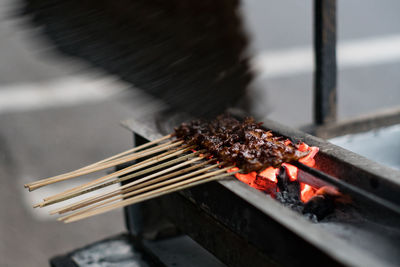 Close-up of meat on barbecue grill