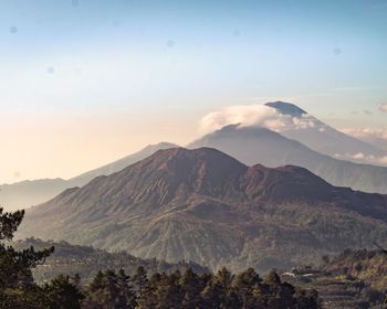 Scenic view of mountains against sky during sunset
