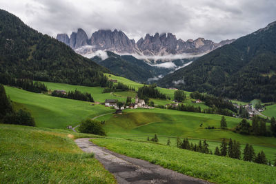 Scenic view of landscape and mountains against sky