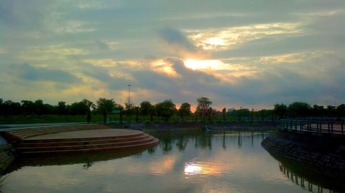 Scenic view of lake against sky during sunset