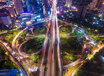 High angle view of light trails on road in city