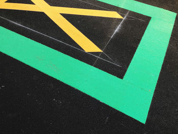 High angle view of arrow sign on road