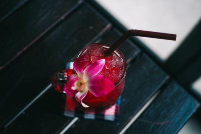 High angle view of red berries on glass