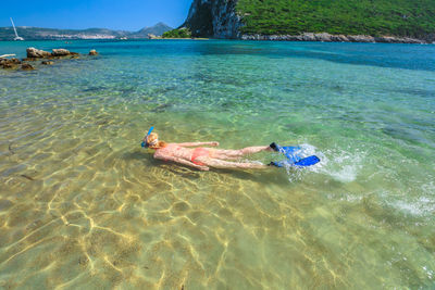 Woman swimming in sea