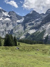 Scenic view of landscape and mountains against sky