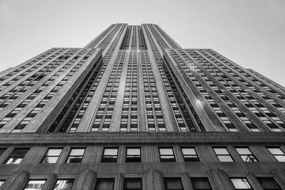 Low angle view of empire state building against sky