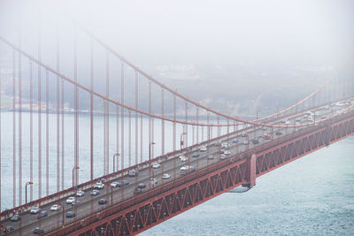 Suspension bridge over river in city