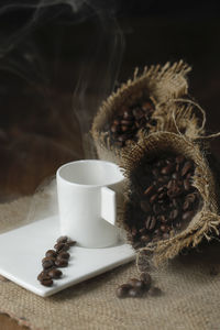 Close-up of coffee beans spilling on table