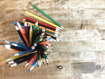 High angle view of multi colored pencils on table