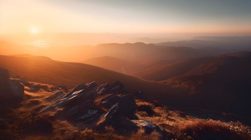 Scenic view of mountains against sky during sunset