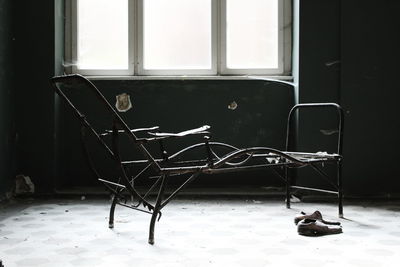 Empty chairs and tables in abandoned room