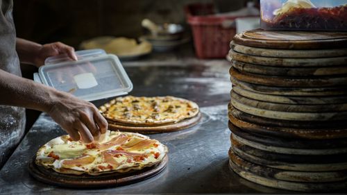 Person preparing food on table