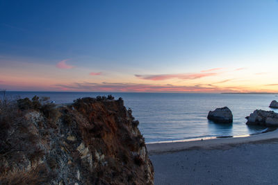 Scenic view of sea against sky at sunset