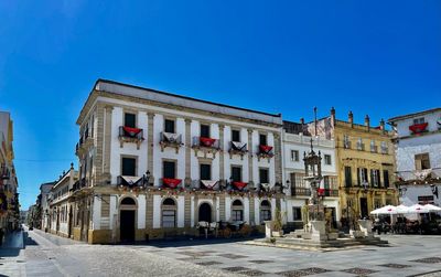 Low angle view of building against blue sky