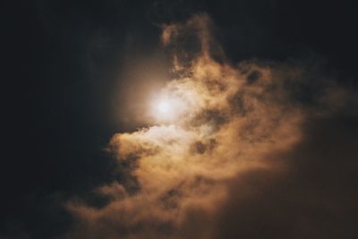 Low angle view of moon in sky at night