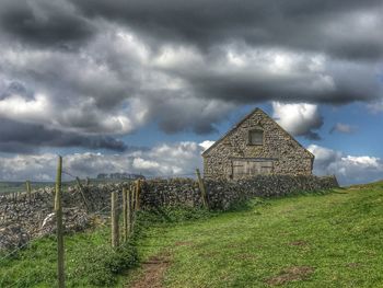 View of storm clouds over field