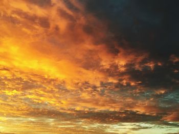 Low angle view of dramatic sky during sunset