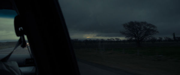 View of road seen through car window