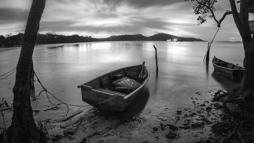 Scenic view of calm lake at sunset