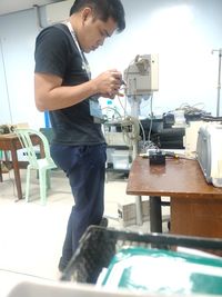 Side view of a man working