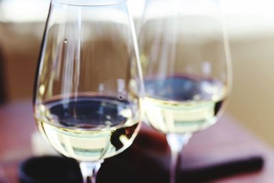 Close-up of wine glasses on table