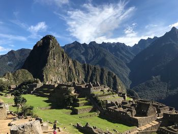 Panoramic view of ruins of mountains against cloudy sky