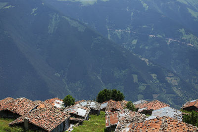 High angle view of townscape against mountains