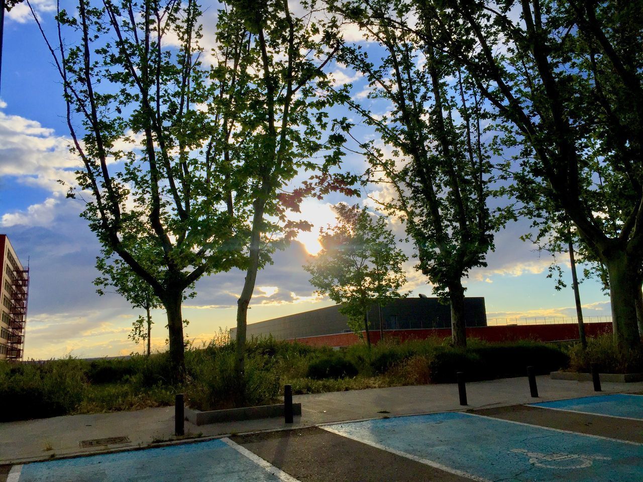 SWIMMING POOL AGAINST SKY AT SUNSET