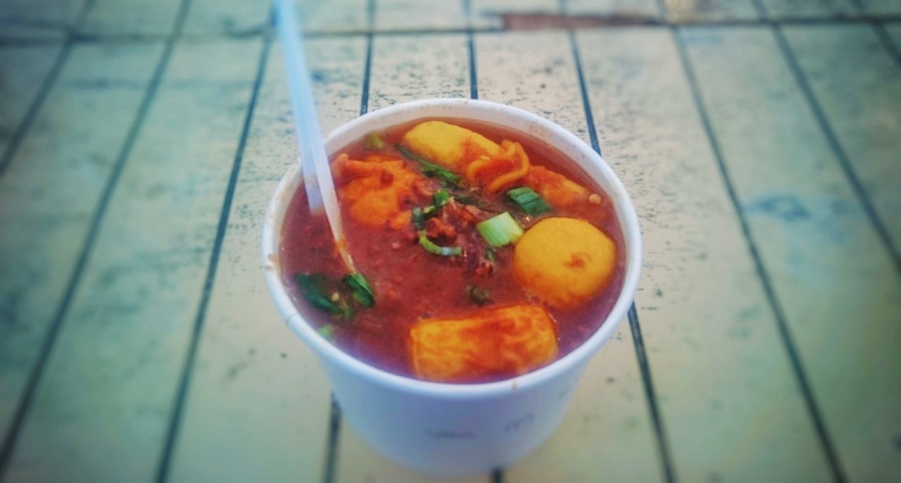 CLOSE-UP OF SOUP IN BOWL ON TABLE