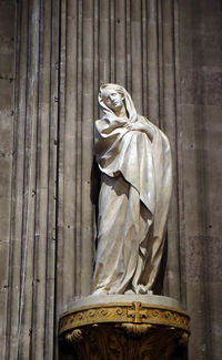 Low angle view of statue against temple