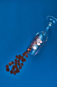 High angle view of bottle against blue background