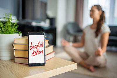 Side view of woman holding gift box