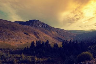 Scenic view of mountains against sky during sunset