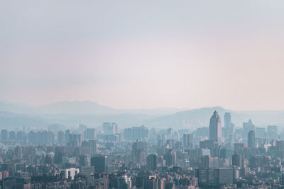 High angle view of buildings in city against sky