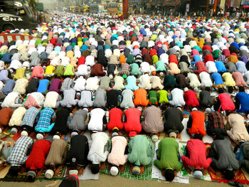 High angle view of people praying on road