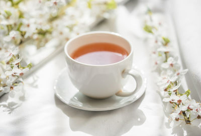 Cup of tea served on table