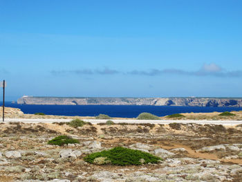 Scenic view of sea against blue sky