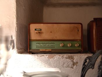 Close-up of telephone booth on wall