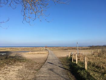 Scenic view of landscape against clear blue sky