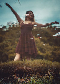 Full length of woman standing on field