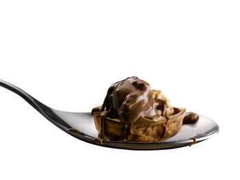 Close-up of chocolate cake against white background