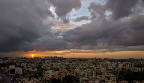 High angle view of city against cloudy sky