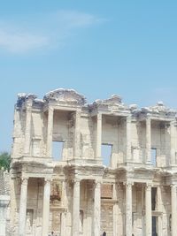 Low angle view of historical building against blue sky
