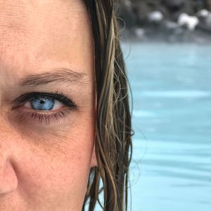 Close-up portrait of woman with swimming pool