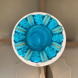 Close-up of blue paint on table