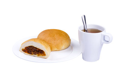 High angle view of breakfast served on table against white background