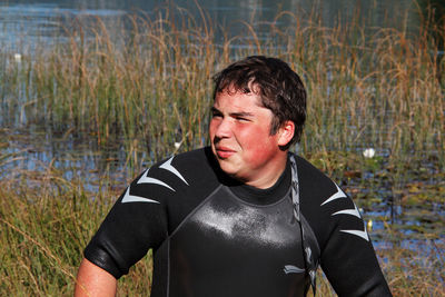 Portrait of man looking at lake