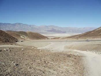 Scenic view of desert against clear sky