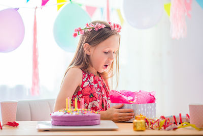 Girl looking away against colored background